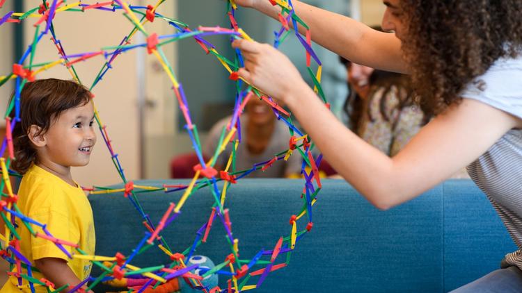 child smiling in expanding toy