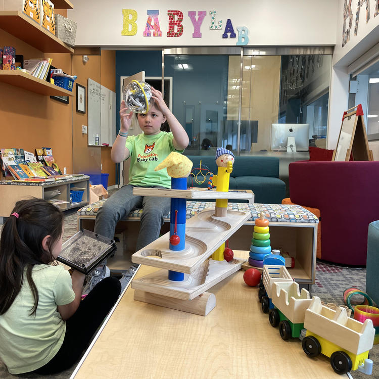 children looking through Baby Lab