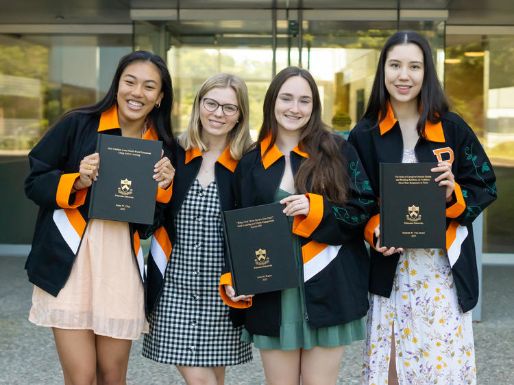 undergraduate students wearing their class jackets