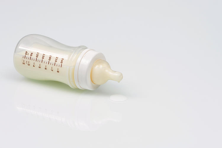 milk from baby bottle spilled on the floor
